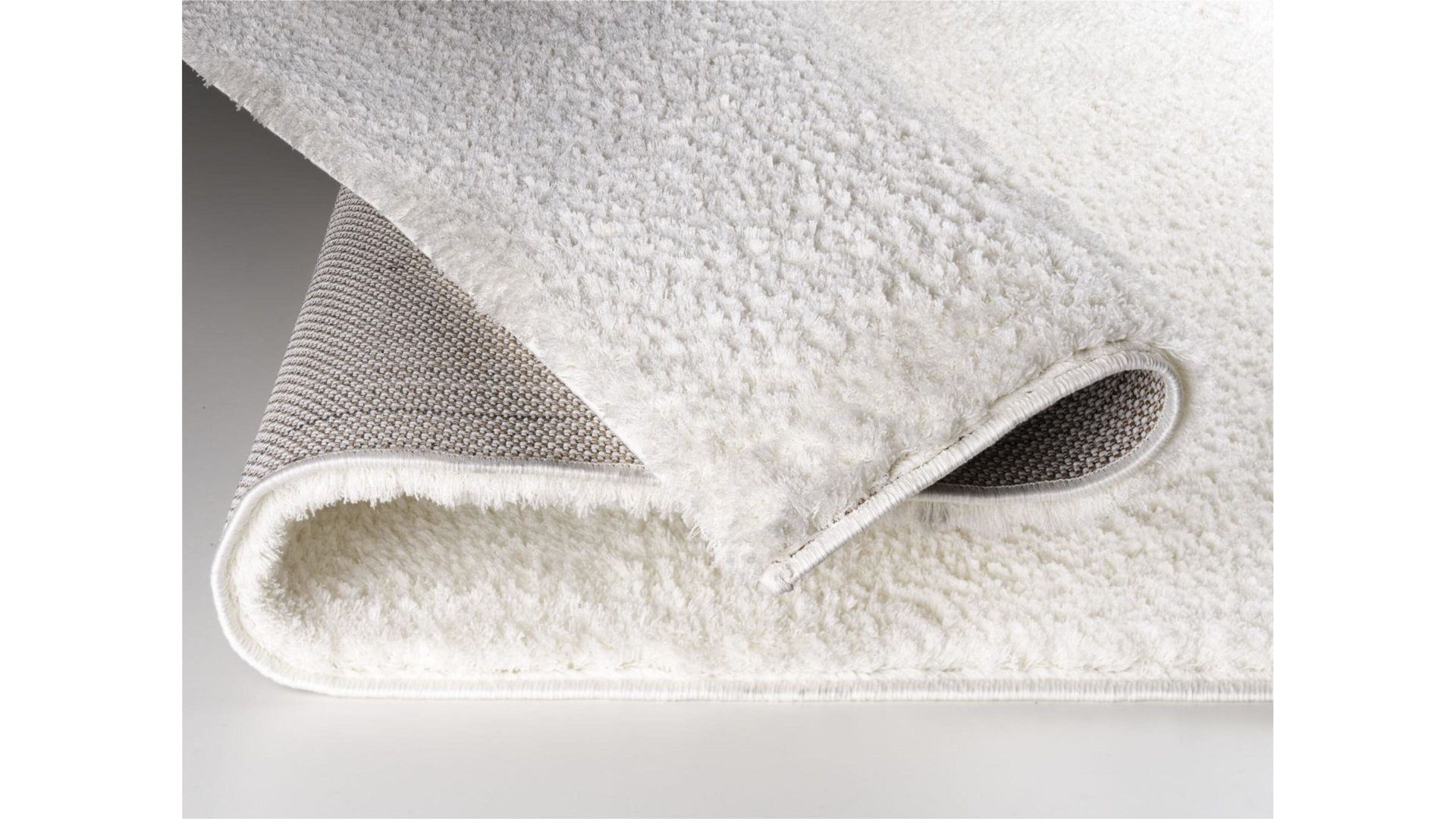 Hochflorteppich Oci aus Kunstfaser in Weiß Hochflorteppich Soft Dream für Ihre Wohnaccessoires cremefarbene Kunstfaser – ca. 65 x 130 cm
