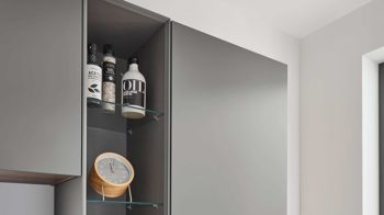 Einbauküche Nobilia® aus Holz in Dunkelgrün nobilia® Einbauküche Easytouch mit BORA Muldenlüfter Mineralgrün & Taupegrau – zweizeilig