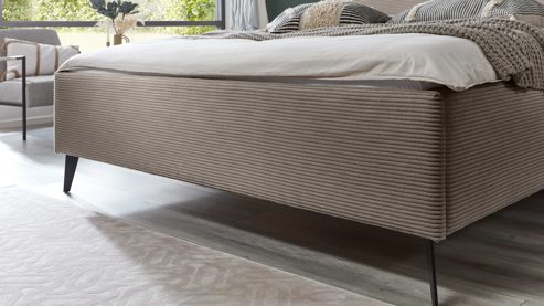 Bettgestell comfortmaster besser sitzen, liegen, leben aus Stoff in Hellbraun Comfortmaster Polsterbettgestell taupefarbener Breitcord Poso 03 & schwarze Metallfüße - Liegefläche ca. 180 x 200 cm