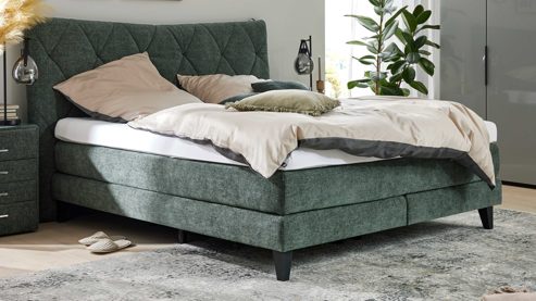 Boxspringbett Interliving aus Stoff in Grün Interliving Bettensystem Serie 1420 - Boxspringbett moosgrüne Chenille Toni & schwarze Holzfüße - Liegefläche ca. 180 x 200 cm